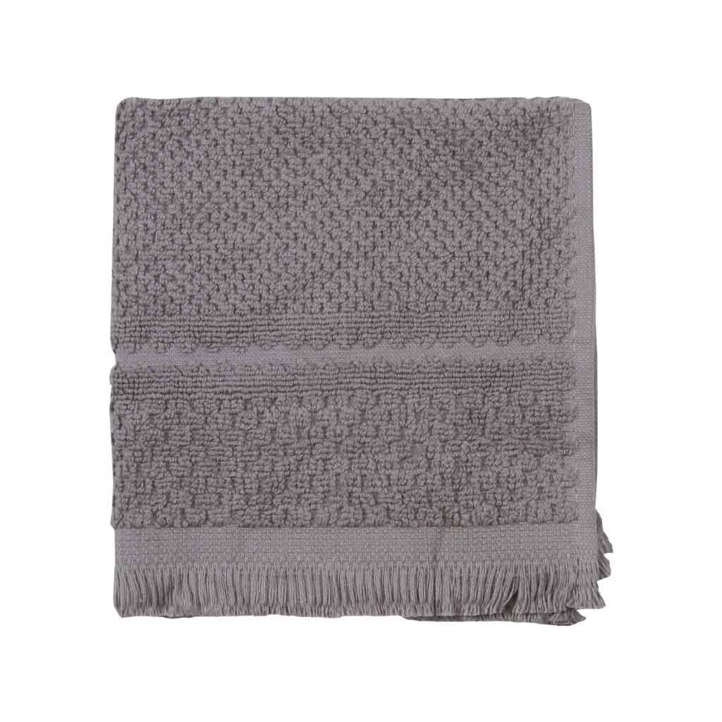 Toalla de cara gris con flequillos en el borde