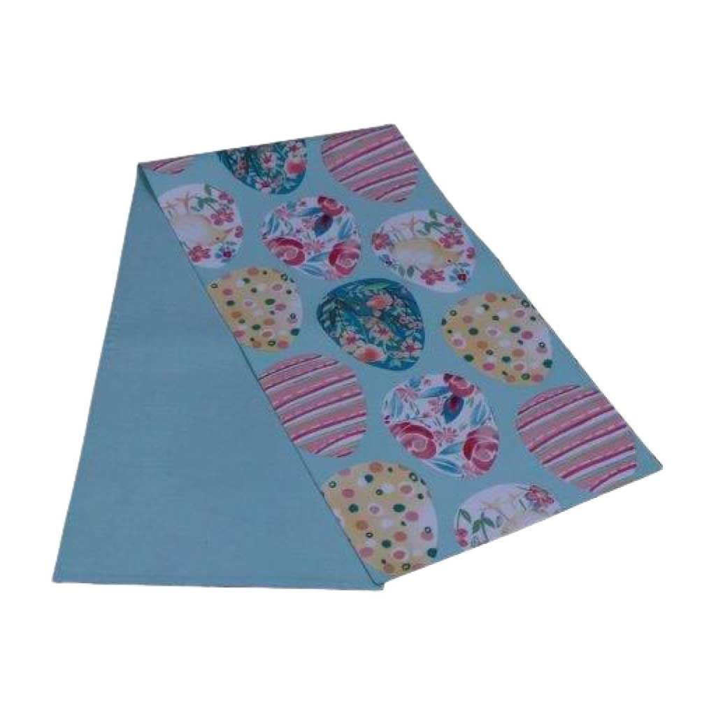 Camino de mesa azul con estampado de huevos decorativos